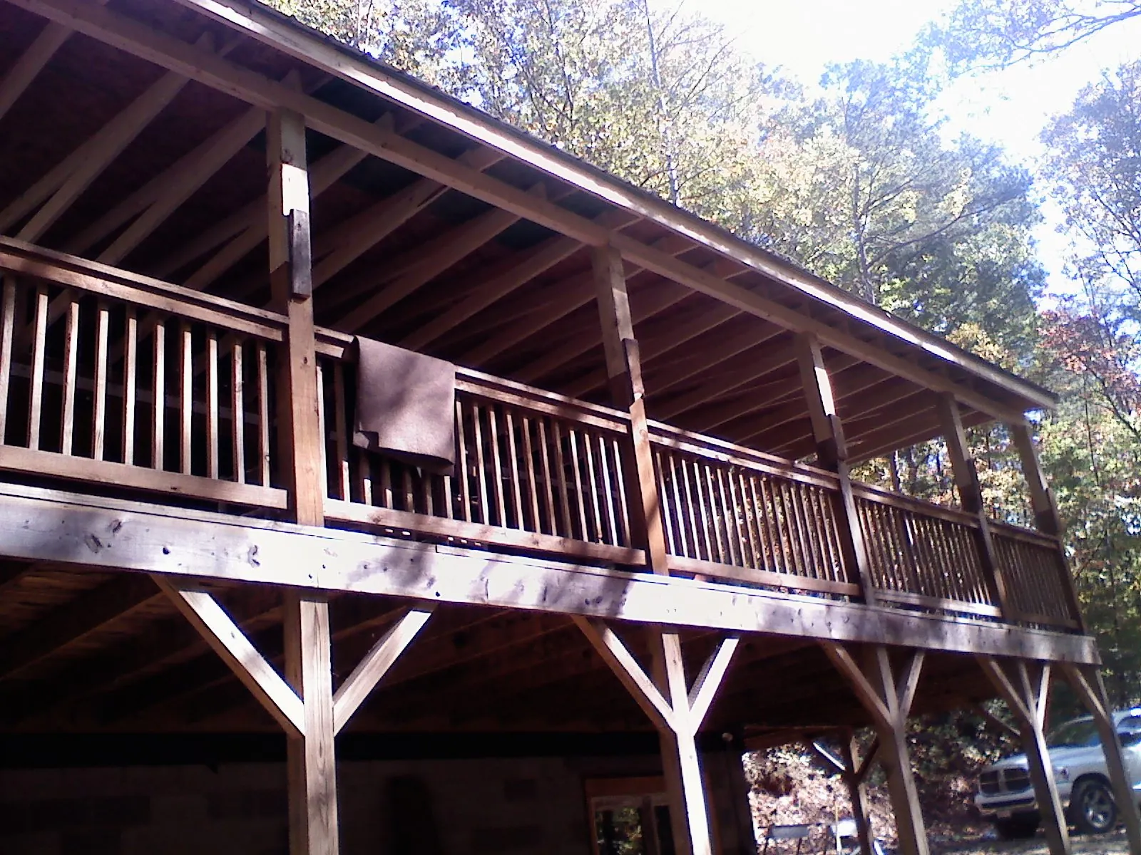 Timber framing under a new elevated porch and deck — Roof Leak Repair in Bolivia by Roofing Brothers